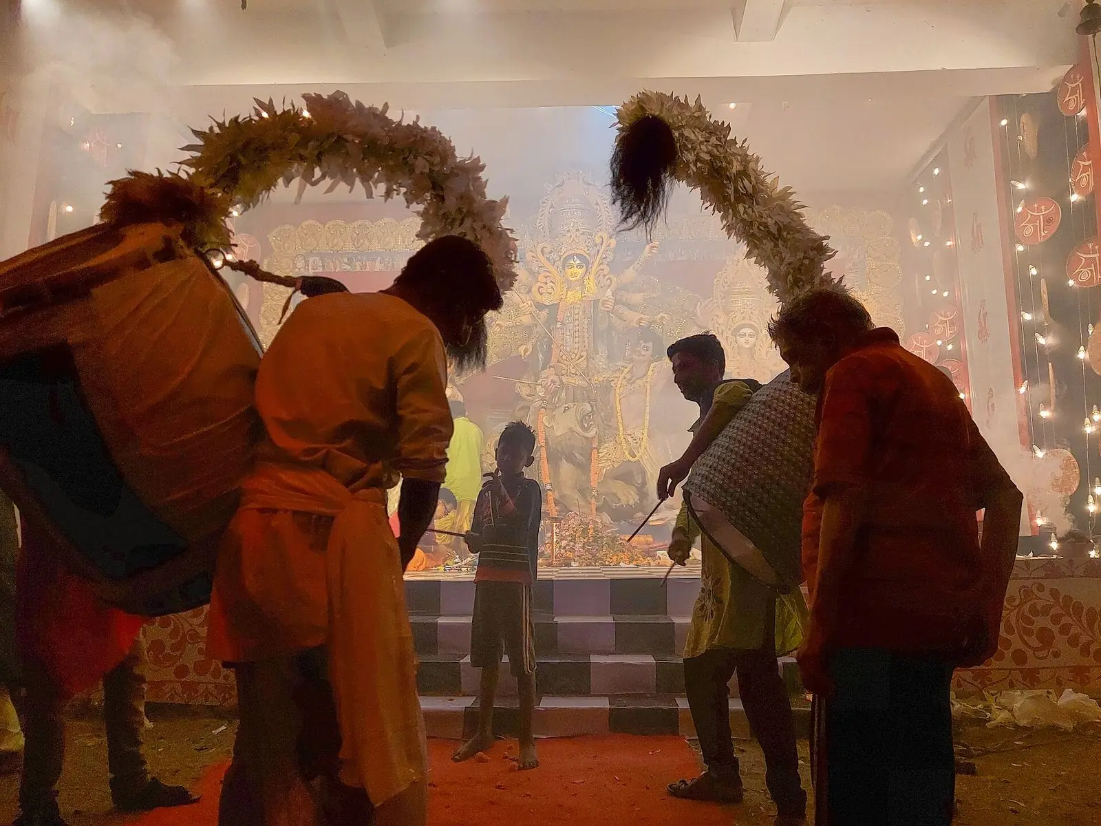 Dhakis playing the dhak at Durga Puja – Durga Puja 2026 dates and pandal map