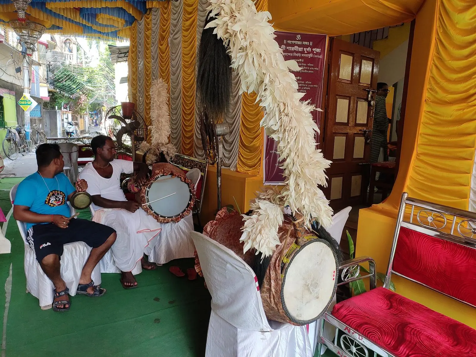 A dhaki playing the dhak