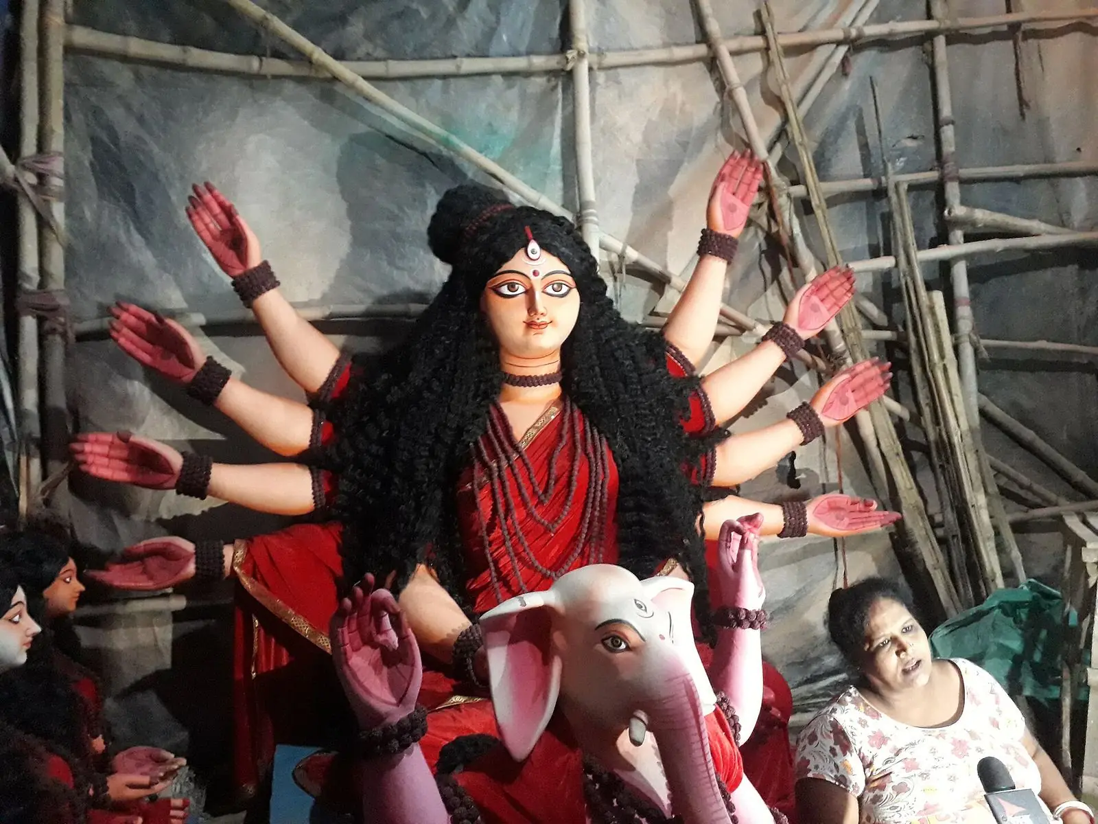 An artisan shaping a Durga idol